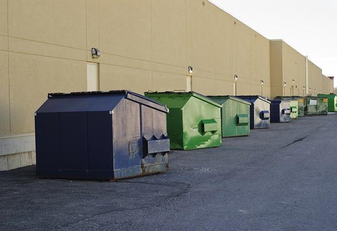 red and green waste bins at a building project in Dorchester